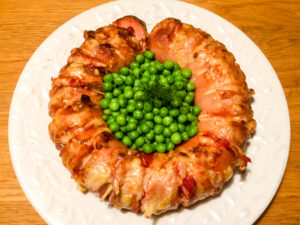 The cooked Falukorv with English peas.