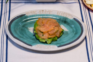 Luscious smoked salmon slices lying on the bread and lettuce.