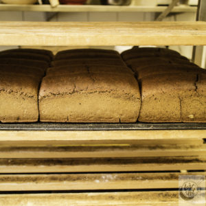 A rack of Kavring bread cooling in the bakery.