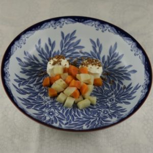 Placing the carrots and celeriac in the bowl. Placing the carrots and celeriac in the bowl.
