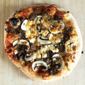 A Swedish Sausage, mushroom, onion and feta pizza.
